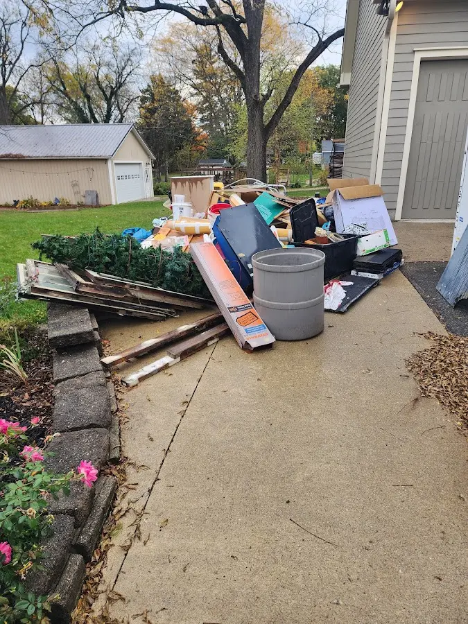 Dumpster being loaded with debris for Roofing Dumpster Rental in Chester